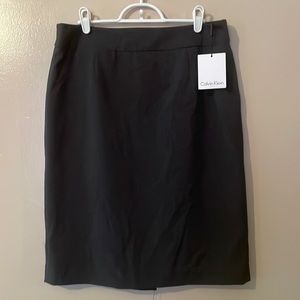 Charcoal grey pencil skirt, back walking slit.